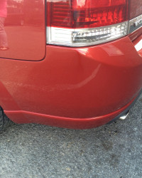 An image of the same red car after we repaired it