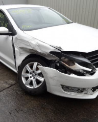 Damaged white Volkswagen car