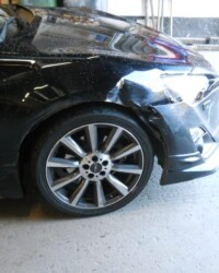 Damaged black car