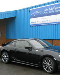 Black car outside garage